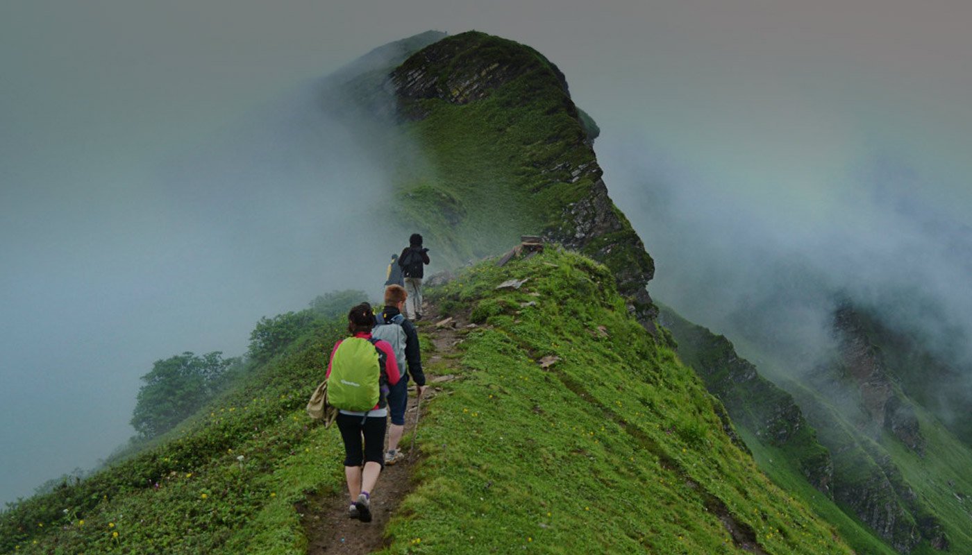 Kayaker paddling through blue water canyons